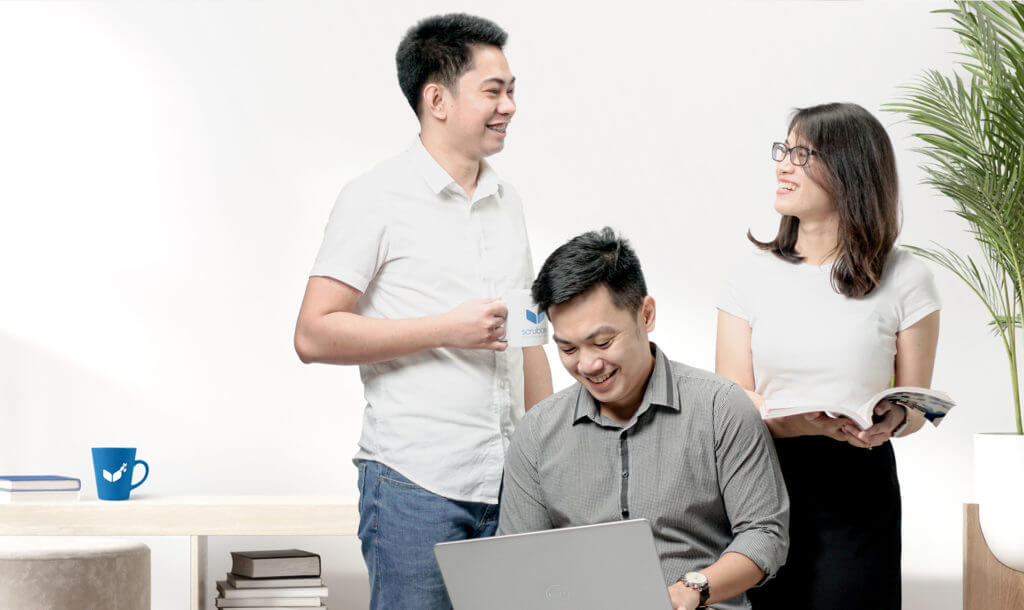 Team members happily working at Scrubbed