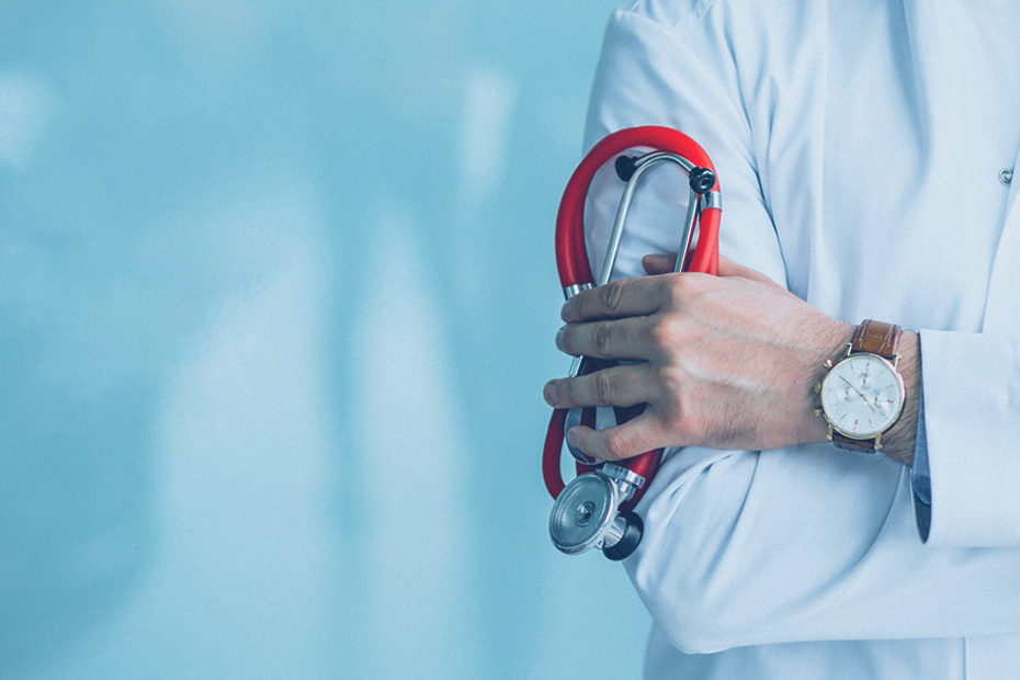 Biotech doctor holding a stethoscope - Scrubbed