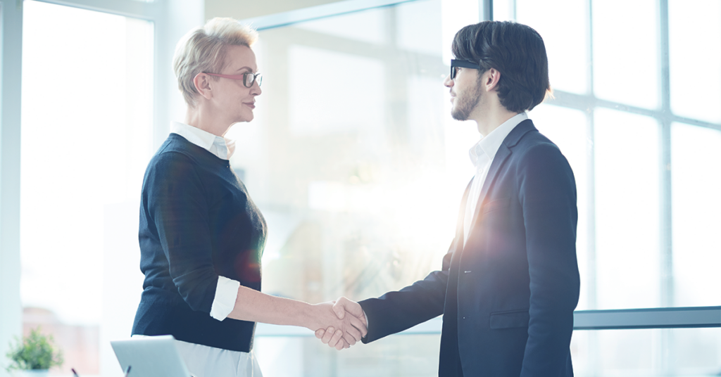 client and business owner shaking hands during onboarding - Scrubbed 2022